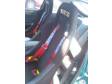 black sparco racing seats with red sparco harness and